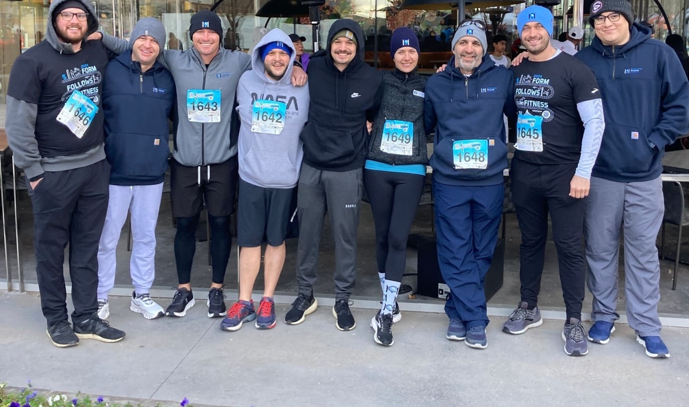 People posing for the camera after an outdoor race