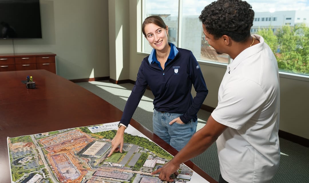WWMC team with blueprint on the table