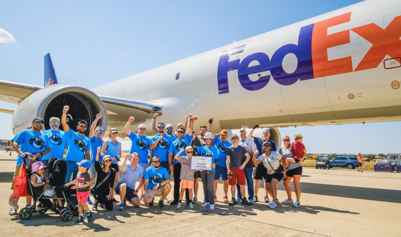 WWMC group in front of a FedEx Plane