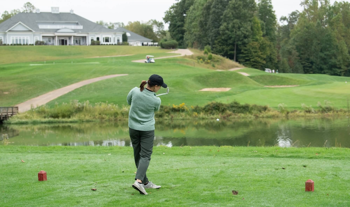 a woman playing golf