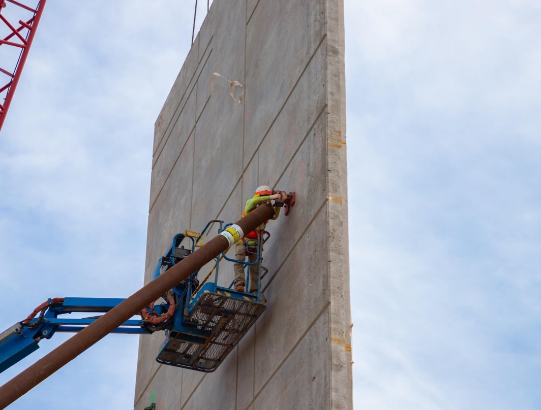 A construction worker building a wall